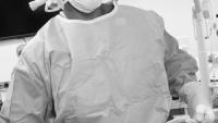 Dr Gill in OR in black and white