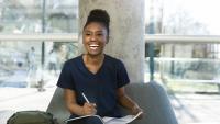 Medical student smiles while studying