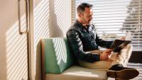 Man reading in doctor's waiting room