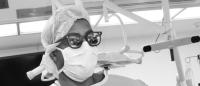 Dr Gill in OR in black and white